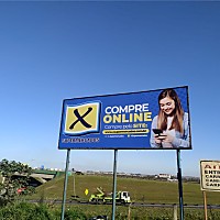 Outdoor em Lona Grande para Rede de Mercado | Gráfica Criarte